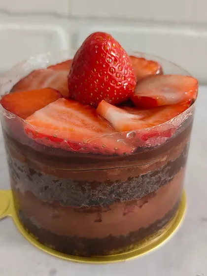 A mini chocolate and strawberry cake, perfect for a small celebration. The combination of rich chocolate and fresh, seasonal strawberries is always a winner.