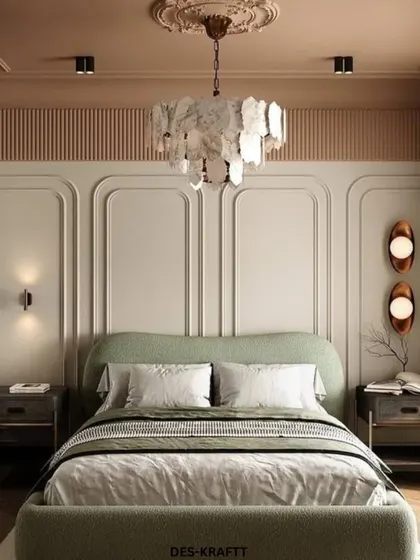 An elegant bedroom featuring a soft sage green bed, intricate wall paneling, and a stunning sculptural chandelier made of natural stone-like elements.