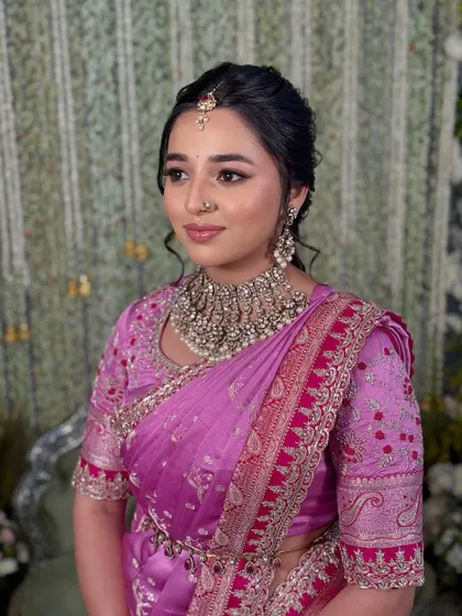 A portrait showcasing the bride's serene expression and the soft, glowing makeup that enhances her natural beauty.