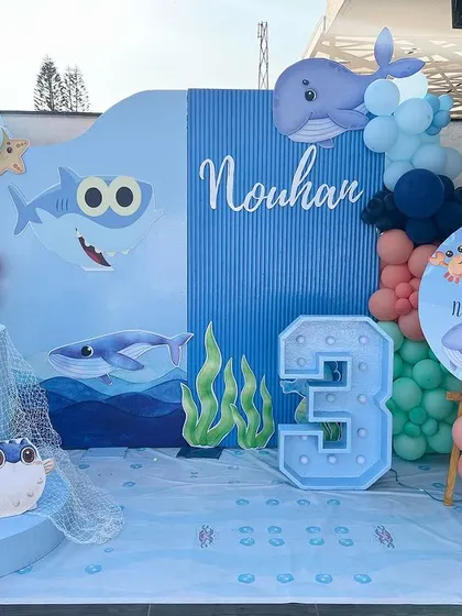 A full view of Nouhan's 'Under the Sea' birthday stage. The setup includes a personalized backdrop, a light-up number '3', and a welcome sign, creating a complete and immersive photo zone.
