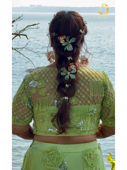 A stunning shot of the Mehendi braid against the backdrop of the sea in Goa.