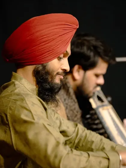 A side profile from a performance in Bangalore, showing the deep concentration required when accompanying another artist.
