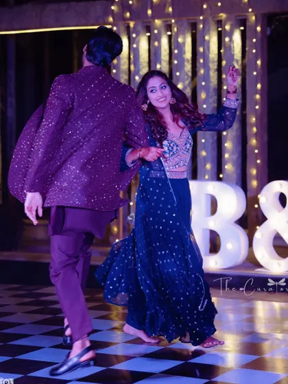 Another joyful snapshot from the dance floor, with the couple lost in the music and the moment, framed by our elegant stage decor.