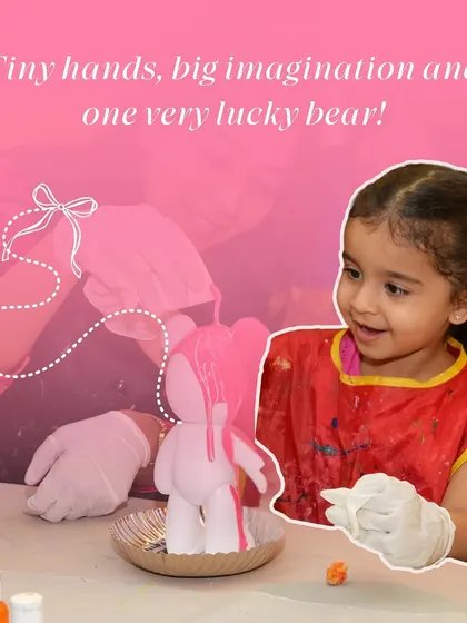 A little girl watches with delight as she pours pink paint over a bear-shaped figure, a fun and popular activity in my kids' workshops.