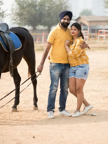 A pre-wedding shoot at a horse ranch near Gurgaon. Using unique locations like this makes for truly memorable and adventurous photos.