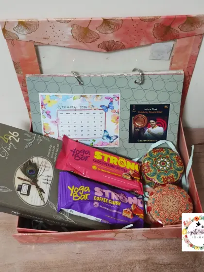 A New Year hamper for actor Gaurav Khanna, featuring a custom photo calendar, a 2026 diary, energy bars, and scented candles in a beautiful gift box.
