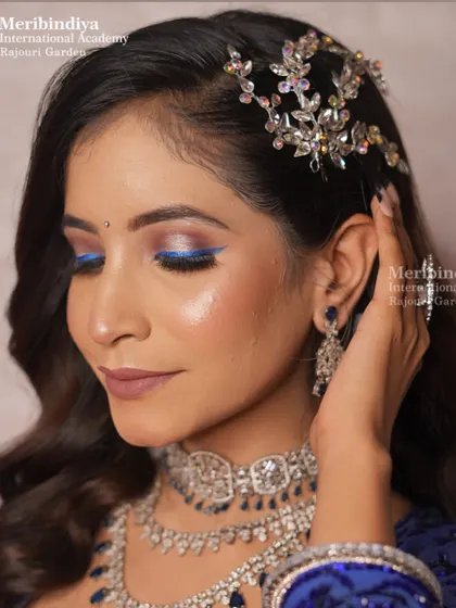 A beautiful engagement hairstyle with soft waves and a delicate, sparkling hair accessory placed on the side.