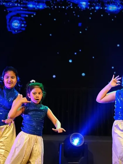 A close-up of our young performers, completely in character for their Bollywood number. Their expressions are as important as their steps.