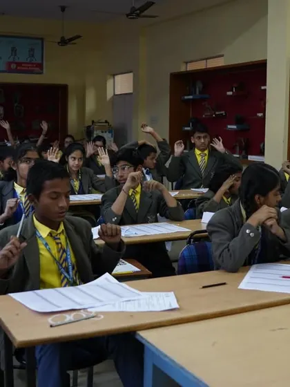 Students using finger techniques for mental calculation during the competition.