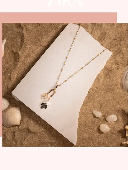 A simple and elegant Italian chain pendant in rose gold, featuring black and white CZ diamond charms.