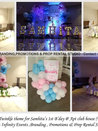 A galaxy-inspired "Twinkle Twinkle Little Star" theme for a first birthday. This setup at an apartment clubhouse uses a pink and blue color palette with a semi-arch and moon backdrop, creating a dreamy and cosmic vibe.