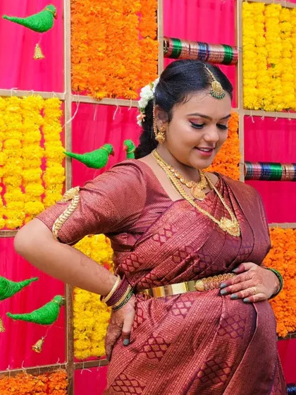 This mom-to-be looks absolutely radiant. The makeup for her baby shower was kept elegant and traditional, with a focus on flawless skin and soft, defined features.