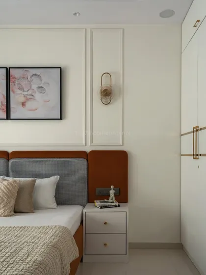 This angle highlights the custom wardrobe with elegant gold handles and inlay, which ties in with the other gold accents throughout the room, creating a cohesive and luxurious feel.