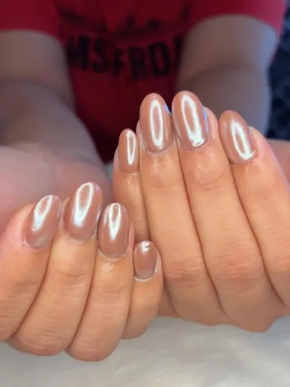 Chocolate glazed nails, a rich brown shade with a high-shine chrome finish.