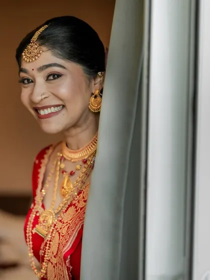 "Happiest brides are the prettiest." This candid shot captures a moment of pure joy, with her makeup looking fresh and radiant.