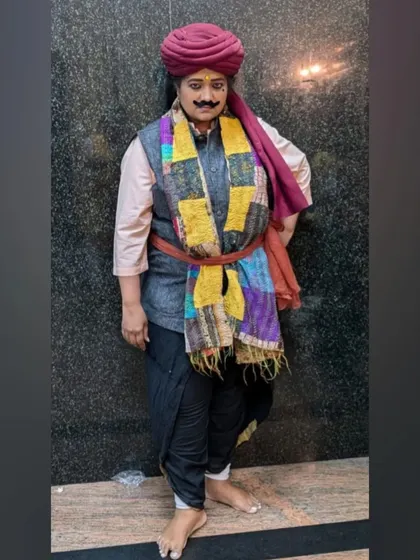 Dressed as a folk character, complete with a colourful turban and scarf. I enjoy exploring the variety of roles that dance dramas offer.