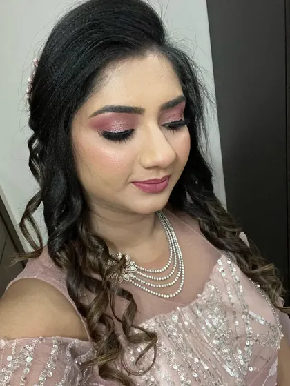 The complete look with pink glitter eyes and soft curls. This is a popular request for cocktail parties and receptions.