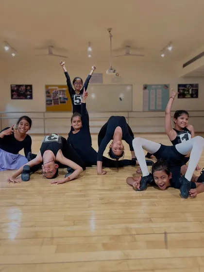A fun and celebratory group pose after completing their jazz exams. It shows both their impressive flexibility and the strong sense of camaraderie in the batch.