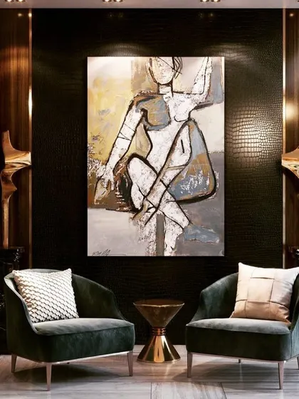 This pair of dark green velvet accent chairs adds a layer of sophistication to this space. The curved back and tapered legs create an elegant silhouette, making them perfect for a formal living area or a luxurious reading corner.