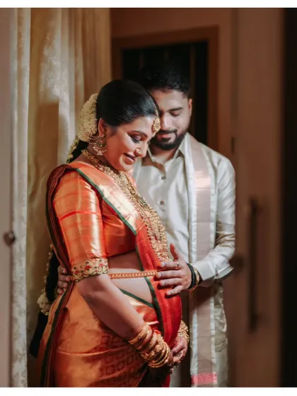 A quiet moment of connection before the little one arrives. I focus on capturing this gentle anticipation, using warm, natural light to highlight the bond between partners during an indoor maternity portrait session.