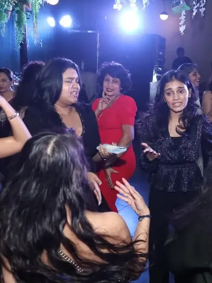 Guests enjoying the music and chatting on the dance floor. A good party has moments of high energy and moments for people to connect.