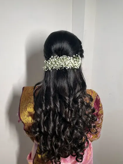 A detailed shot of a beautiful bridal hairstyle created by one of the talented hairstylists I collaborate with. This half-up, half-down style with baby's breath is romantic and timeless.