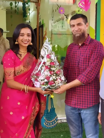 Gratefully accepting a bouquet from a well-wisher. The support from our community on opening day was truly overwhelming and encouraging.
