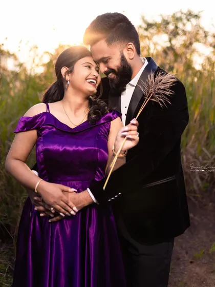 Pure happiness and love captured in a single frame. This couple's coordinated outfits, a purple gown and a black blazer, look stunning in the warm, glowing sunlight.