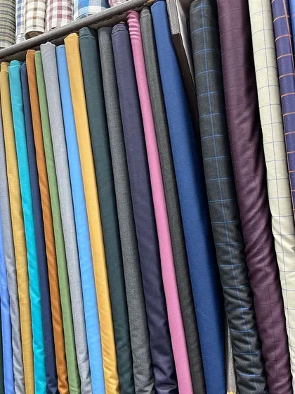 A vibrant selection of fabrics in various colors and textures. No matter the occasion, I have the right material to bring your design to life.