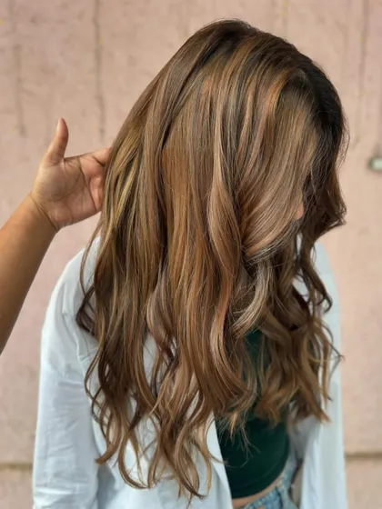 The layers in this cut work perfectly with the mochaccino color to create movement and texture. (No filter)