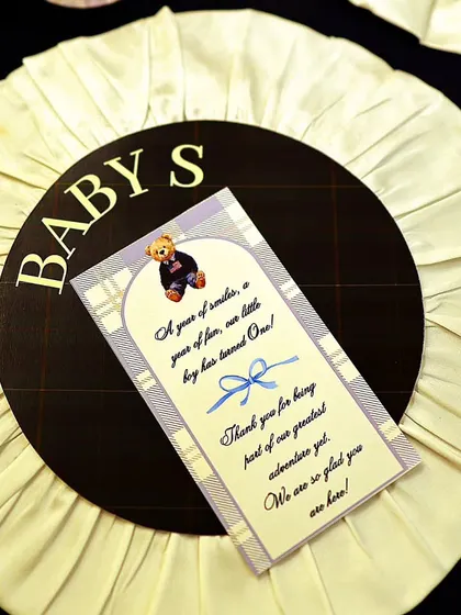 Custom-made rosettes served as unique place cards and party favors. This detail, inspired by equestrian awards, was a perfect nod to the 'Polo Club' theme and a delightful keepsake for guests.