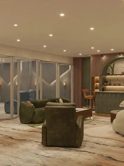 The bar area is defined by an arched, marble-like backdrop, a textured bar counter, and plush olive green seating.