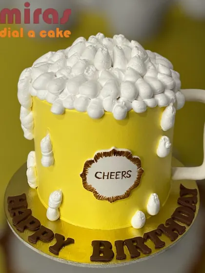 A "brew-tiful" cake shaped like a frothy mug of beer. This fun and unique design is perfect for celebrating a beer lover's birthday with a sweet twist.