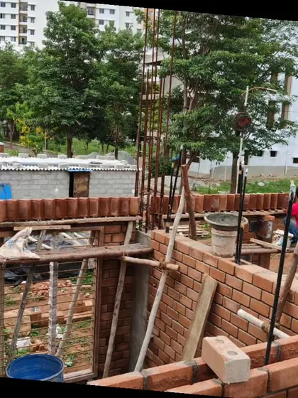 A wall being built with stabilized earth blocks. This versatile material can be used for exposed walls, for shuttering, or as cladding.