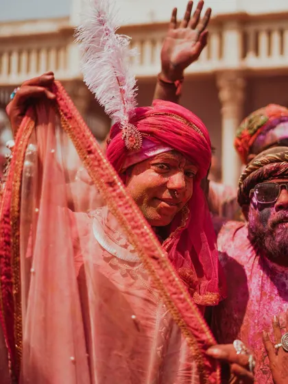 A vibrant collection of images from the Holi celebrations in Braj, specifically Nandgaon. This series captures the pure ecstasy of the festival, with portraits of devotees, men dressed as gopis, and crowds dancing in a cloud of colors.