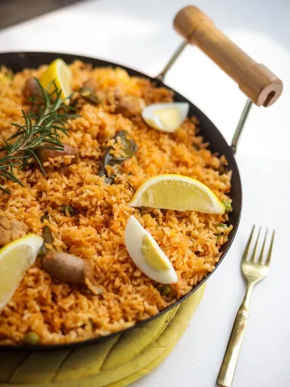 Another look at our vibrant and flavorful paella, cooked and served in the traditional pan.