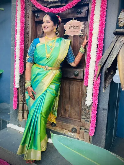 A beautiful pose showcasing the complete bridal attire. The combination of the vibrant saree, traditional jewellery, and my signature makeup style creates a picture-perfect moment.