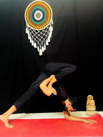 A variation of Dolphin Pose that provides a deep hip and shoulder opening. This posture prepares the body for more advanced inversions and backbends.