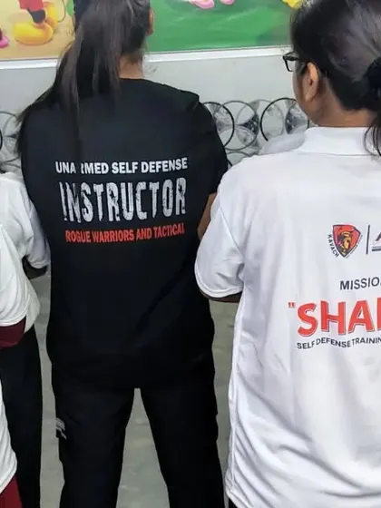 My female instructor guiding participants. Having female trainers is essential for creating a comfortable and relatable learning environment for women.
