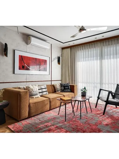 The full living room, showing how natural light from the large windows fills the space, creating a bright and airy atmosphere.