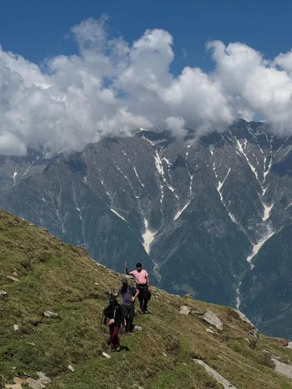 The trail to Bhrigu Lake offers stunning views of the surrounding snow-capped mountains.