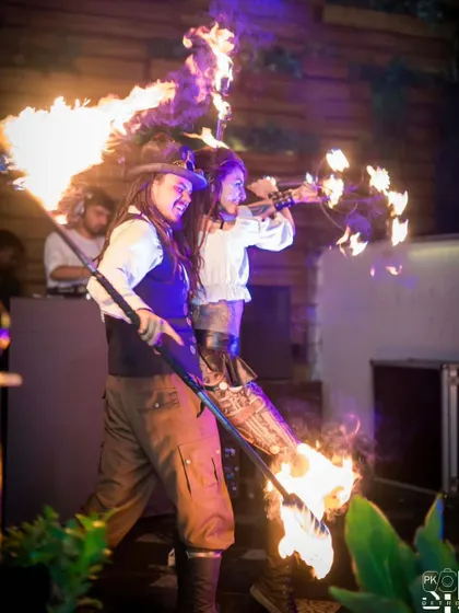 A high-energy moment from the Steampunk duo show, featuring a flamethrower and fire eating. This act combines storytelling with our most spectacular fire tricks.