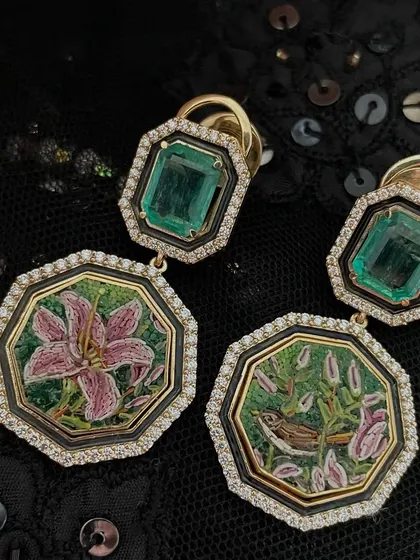 The "Stories of the Lilium" continue with these Art Deco inspired micromosaic earrings. Featuring buds, blooms, and a bird, they are handcrafted in 18k gold with Zambian emeralds and a touch of black enamel.