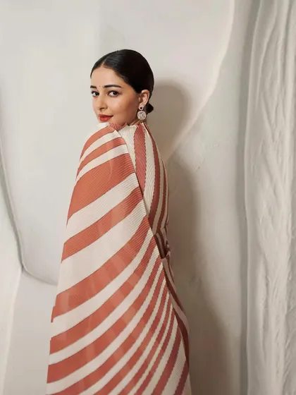 Ananya Panday looking effortlessly chic. The handcrafted earrings provide a focal point, showcasing the detailed micromosaic art and the sparkle of natural diamonds.