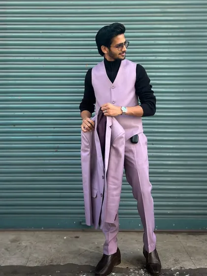 A stylish shot of our client in the lavender three-piece suit, showing how it can be worn for a cool, contemporary look.
