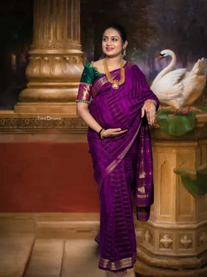A picture of elegance and anticipation. This portrait captures the beauty of a traditional maternity look, with the mom-to-be gently holding her baby bump.