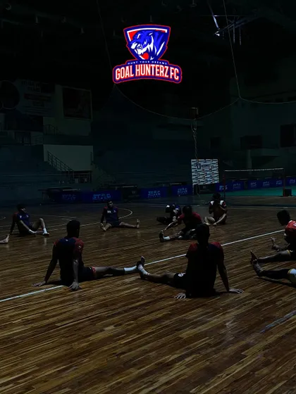 The Goal Hunterz FC team stretches under their illuminated logo. The dramatic lighting showcases our ability to create a unique and branded atmosphere for any team.