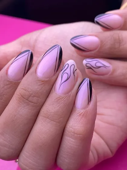 A cool and edgy design on a sheer pink base. This set features a mix of sharp black lines and delicate flame art, perfect for a subtle yet statement-making manicure.