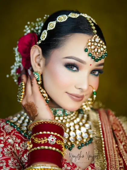 This is the look every bride dreams of. I focused on creating striking green smokey eyes that complement the traditional jewelry, paired with a flawless, radiant skin finish. This HD makeup is designed to be long-lasting and look perfect both in person and on camera.