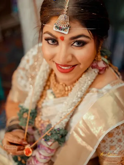 A close-up shot of the bride's radiant smile during her wedding ceremony.